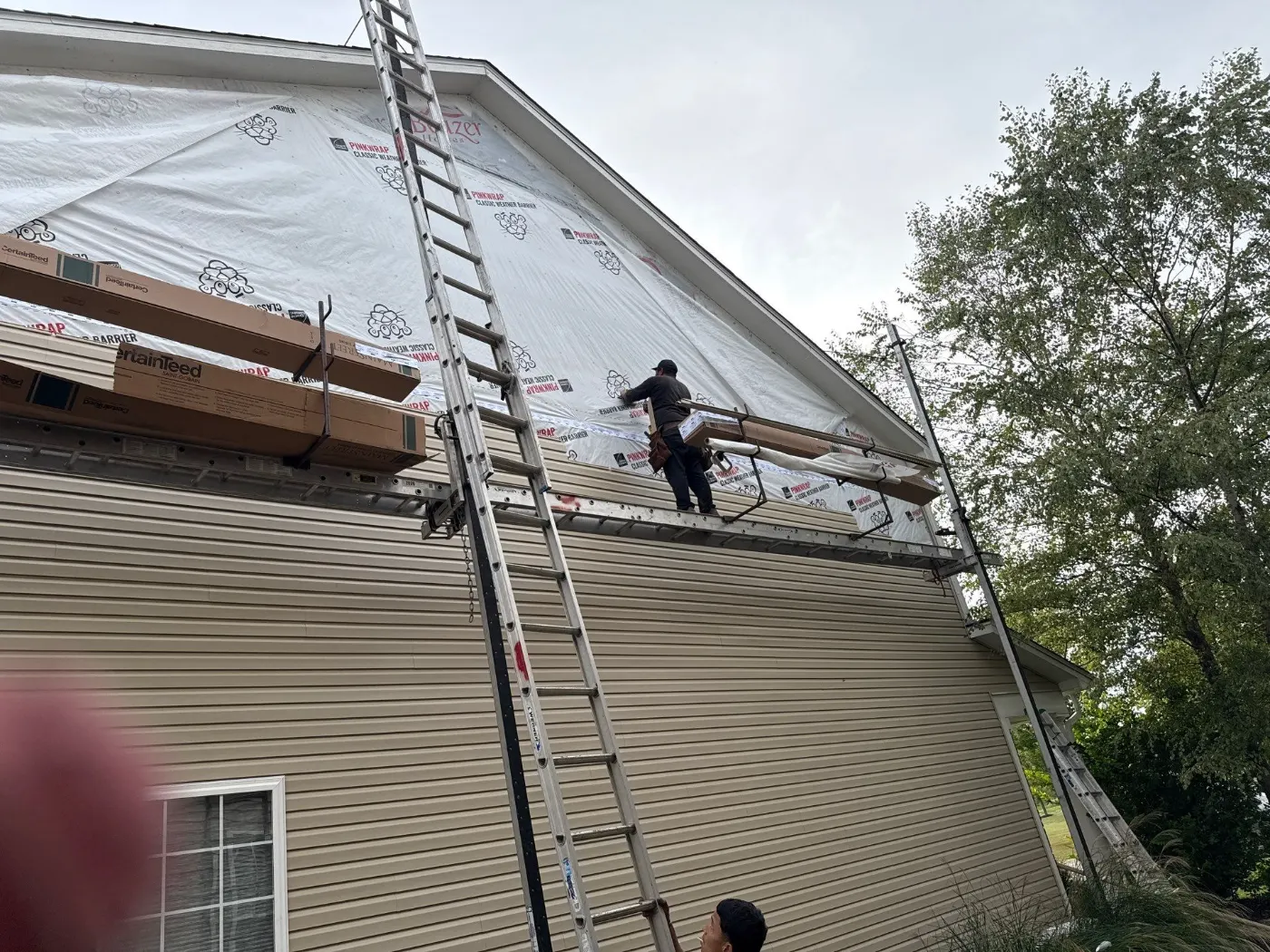 Tarping and dry-in on a Geist Overlook commercial roof